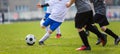 Football Tournament for Youth Soccer Clubs Academies. School Sports Competition. Four Young Boys in White and Black Soccer Jersey Royalty Free Stock Photo