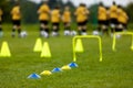 Football Training Session. Soccer Balls, Pylons, Cones, Marks and Training Hurdles on Grass Pitch Royalty Free Stock Photo