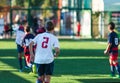 Football training soccer for kids. Boy runs kicks dribbles soccer balls. Young footballers dribble and kick football ball in game Royalty Free Stock Photo