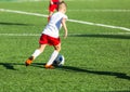 Football training soccer for kids. Boy runs kicks dribbles soccer balls. Young footballers dribble and kick football ball in game. Royalty Free Stock Photo