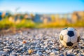 Football, volleyball, black and white ball lying on the street near the stadium Royalty Free Stock Photo