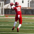 Football wide receiver catching the ball