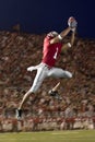 Football Wide Receiver Making a Leaping Catch