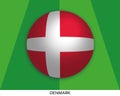 Football World championship with Denmark flag made round as soccer ball on a playing grass