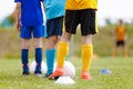 Footballers Standing in Line at Training Session. Soccer Goalie Standing in a Goal in Blurred Background Ready to Save Royalty Free Stock Photo