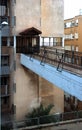 Footbridge connecting street sidewalk with entrance to apartment