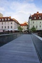 Footbridge with glass balustrade crossing the river Ljubljanica