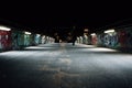 Footbridge with graffitis on wall in Luebeck at night