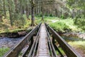 Footbridge over the river severn in hafren forest, Wales. The bridge is part of a walking trail