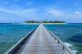 Footbridge over turquoise ocean to Island