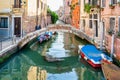 Footbridge over the water canal called Ponte Chiodo in Venice, Italy. Bridge without balustrades Royalty Free Stock Photo