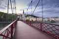 Footbridge and view of old city of Lyon at sunset, France Royalty Free Stock Photo