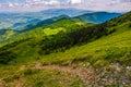 Footpath down the hill through forest on mountain ridge Royalty Free Stock Photo