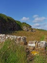 The footpath of the Fife Coastal Path wends its way past low Sandstone Outcrops overlooking the rugged Coastline Royalty Free Stock Photo