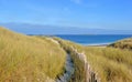 Footpath in the dunes bordered by a wooden fence by the sea in Brittany Royalty Free Stock Photo