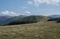 Footpath of hiking trail from Chopok ridge with mountain meadow, scrub pine and view of blue green hills ridge Royalty Free Stock Photo