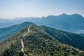 Footpath on the hiking trail toward  mountains, Sai Kung, Hong Kong, outdoor, daytime Royalty Free Stock Photo