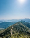 Footpath on the hiking trail toward  mountains, Sai Kung, Hong Kong, outdoor, daytime Royalty Free Stock Photo