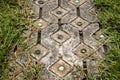 Footpath pavement decorate by glass ball with green grass frame