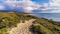 Footpath on the sand dunes of Ano Nuevo State Park; storm clouds visible in the background; Pacific Ocean Coastline, California Royalty Free Stock Photo