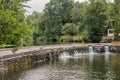 Footpath in stone weir with flowing water at Coja beach of river Alva, Arganil PORTUGAL