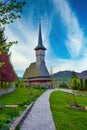 Footpath to traditional Maramures neo gothic wooden church in Barsana monastery, Romania Royalty Free Stock Photo