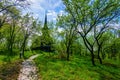 Footpath to traditional Maramures wooden church. UNESCO world heritage site. Barsana, Romania Royalty Free Stock Photo