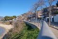 Footpath with walking unknown people along the Mediterranean sea in Spain Royalty Free Stock Photo