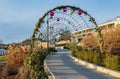 A footpath walkway in the park decorated with ark and balls, the footpath passes by the bench, sidewalk, sideway Royalty Free Stock Photo