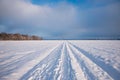 footpath in winter landscape along the power supply line Royalty Free Stock Photo