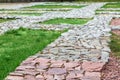 Footpaths made of natural rough stone.
