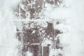 Footpints on snow. Snow tracks from shoes on stone tiles. Footprints on the pavement. On the stone steps. on the stairs. Texture