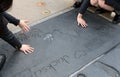 Footprint and hand prints of Bob Daly Terry Semel at Graumans TCL Chinese Theater in Hollywood, Los Angeles, California USA. Royalty Free Stock Photo