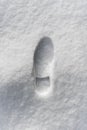 Footprint of a man in a boot in the snow Royalty Free Stock Photo