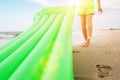 Footprint on sand - boy with swimming mattress walks on the sand Royalty Free Stock Photo