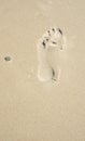 Footprint in sand w/ Stone