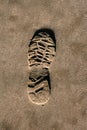 Footprint shoe on beach brown sand texture print Royalty Free Stock Photo