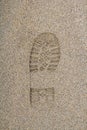 Footprint from a shoe on a sandy surface