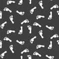 Footprint silhouettes vector seamless pattern black monochrome print.