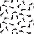 Footprint silhouettes vector seamless pattern monochrome print.