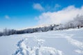 The footprint on snowfield and blue sky