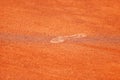 Footprint on tennis clay court