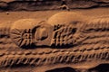 Footprint with tread shoes on a sandy surface