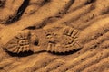 Footprint with tread shoes on a sandy surface