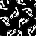 Footprint vector seamless pattern, white feet on a black background