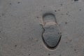 footprint on the wet sand near the sea