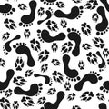 Footprints and animals dog or cat paws print on white seamless pattern Royalty Free Stock Photo