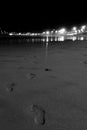 Footprints on the beach at night