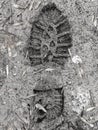 Footprints of boots on the frozen ground as a background Royalty Free Stock Photo