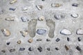 Footprints on the cement. Royalty Free Stock Photo